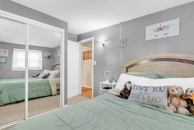 carpeted bedroom with a closet