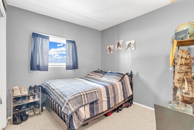 bedroom featuring carpet floors and baseboards