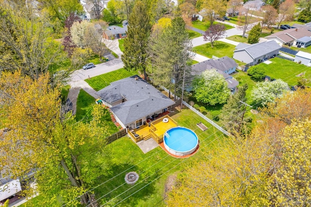 aerial perspective of suburban area featuring a pool area