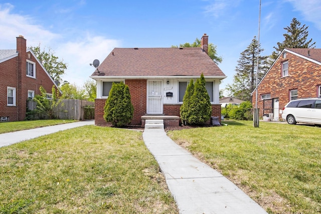 8105 Bramell, Redford, MI 48239 - bungalow-style house with brick siding, roof with shingles, and a chimney