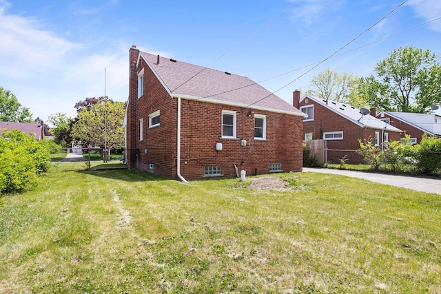 8105 Bramell, Redford, MI 48239 - view of side of property with a chimney, brick siding, and a shingled roof