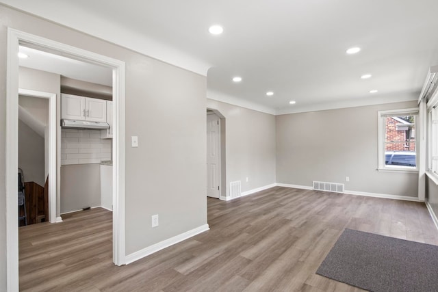 8105 Bramell, Redford, MI 48239 - spare room with arched walkways, light wood-type flooring, recessed lighting, and baseboards