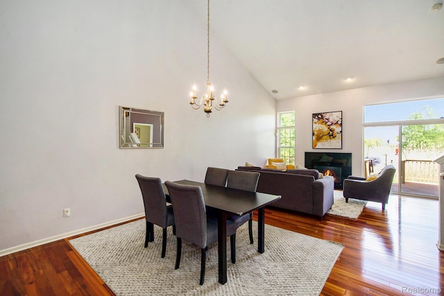 235 Cherry Stone Dr Unit 16, Canton, MI 48188 - dining area featuring plenty of natural light, a chandelier, a glass covered fireplace, hardwood / wood-style floors, and recessed lighting
