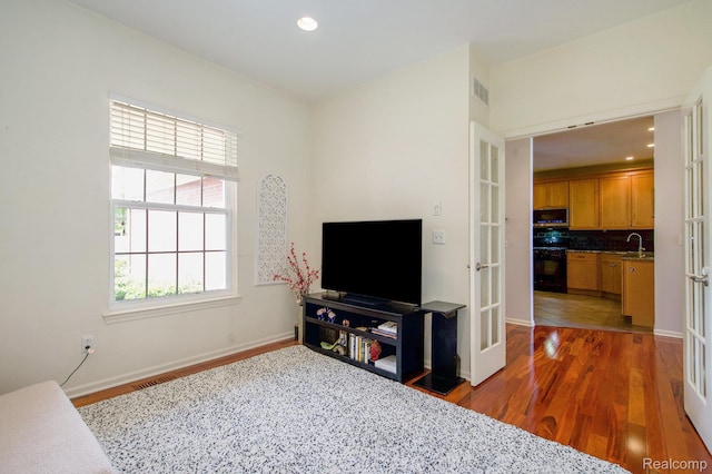 235 Cherry Stone Dr Unit 16, Canton, MI 48188 - living area featuring wood finished floors, baseboards, recessed lighting, and french doors