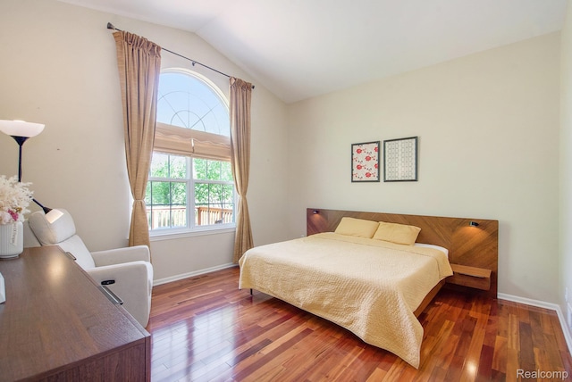 235 Cherry Stone Dr Unit 16, Canton, MI 48188 - bedroom with baseboards, vaulted ceiling, and wood finished floors