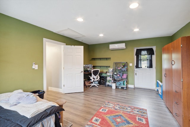1812 Orchard St, Ann Arbor, MI 48103 - bedroom featuring a wall mounted AC, light wood-style floors, baseboards, recessed lighting, and an office area