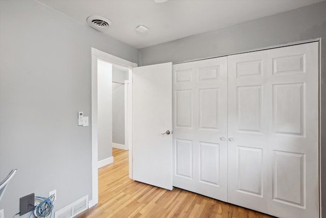 1812 Orchard St, Ann Arbor, MI 48103 - unfurnished bedroom with light wood finished floors, a closet, and baseboards