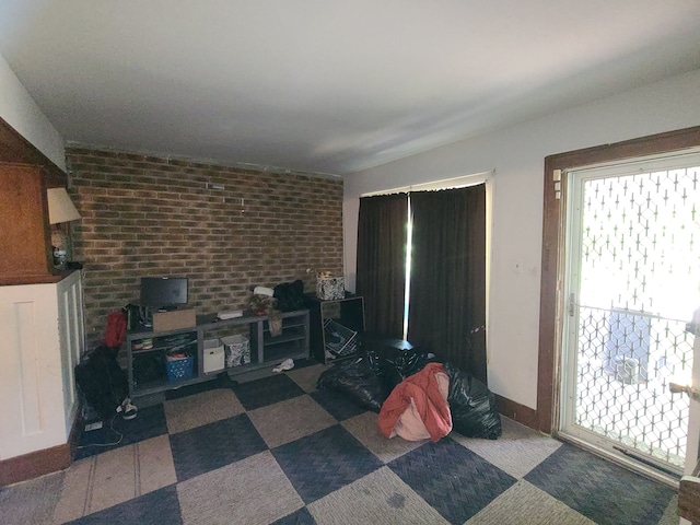 1814 Jasmine Ave, Flint, MI 48503 - living area featuring brick wall