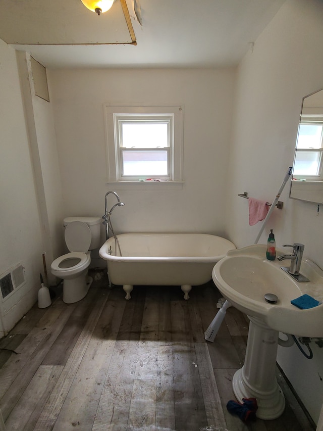 1814 Jasmine Ave, Flint, MI 48503 - full bath with hardwood / wood-style flooring, a freestanding bath, and plenty of natural light