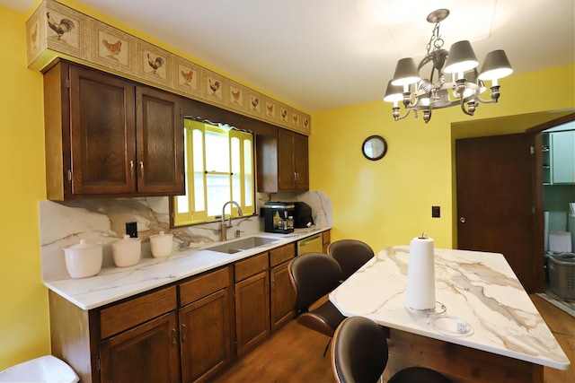 6452 Brian Circle Ln, Burton, MI 48509 - kitchen with a sink, a chandelier, backsplash, dark wood-style flooring, and hanging light fixtures
