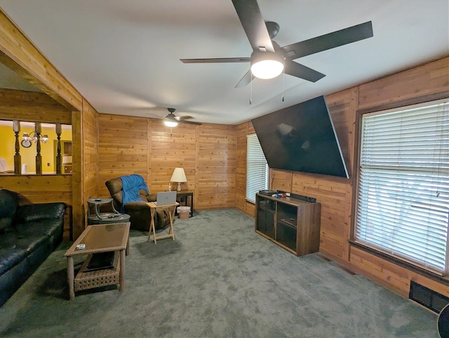 6452 Brian Circle Ln, Burton, MI 48509 - carpeted living room with wood walls and ceiling fan