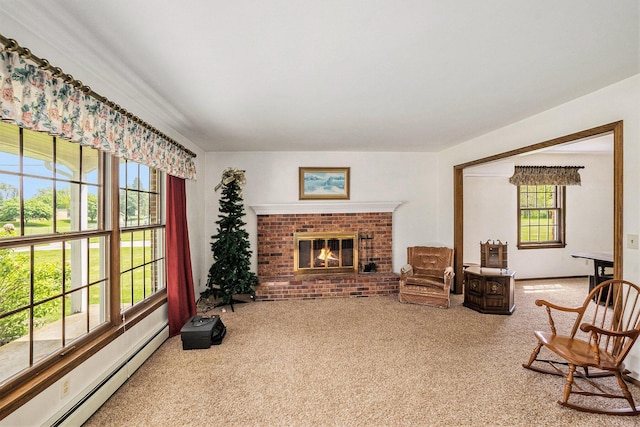 200 Brink St, Grant, MI 49327 - living room featuring baseboard heating, carpet, and a fireplace
