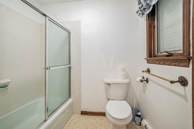 200 Brink St, Grant, MI 49327 - bathroom featuring toilet, shower / bath combination with glass door, a baseboard heating unit, baseboards, and tile patterned flooring