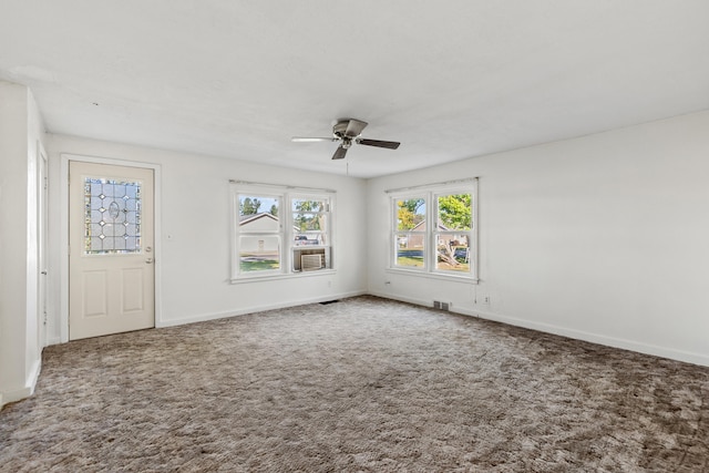 434 Walnut St, Howard City, MI 49329 - unfurnished room with a ceiling fan, carpet floors, and baseboards