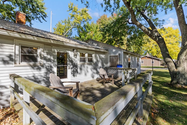 434 Walnut St, Howard City, MI 49329 - deck featuring a lawn