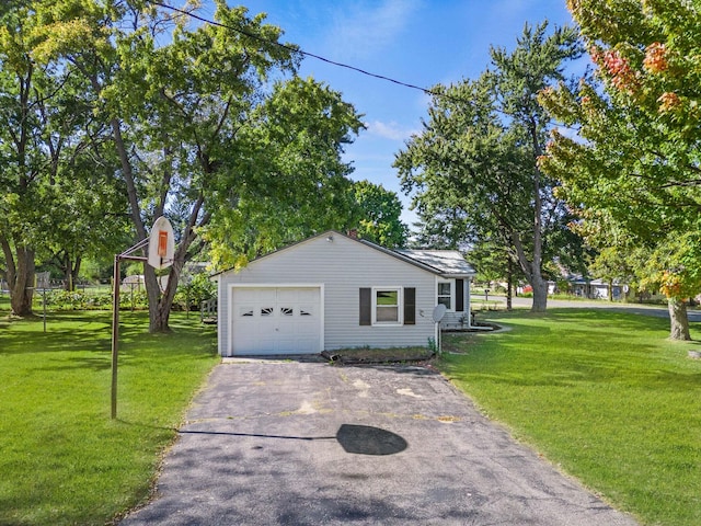 434 Walnut St, Howard City, MI 49329 - view of side of property with driveway and a lawn