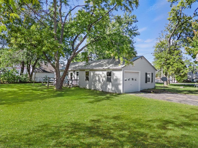 434 Walnut St, Howard City, MI 49329 - view of green lawn with asphalt driveway