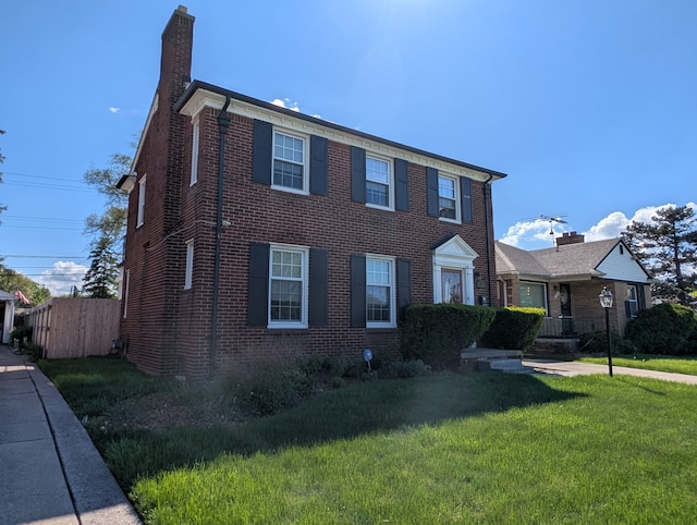 9864 E Outer Dr, Detroit, MI 48224 - view of front facade featuring a chimney and brick siding