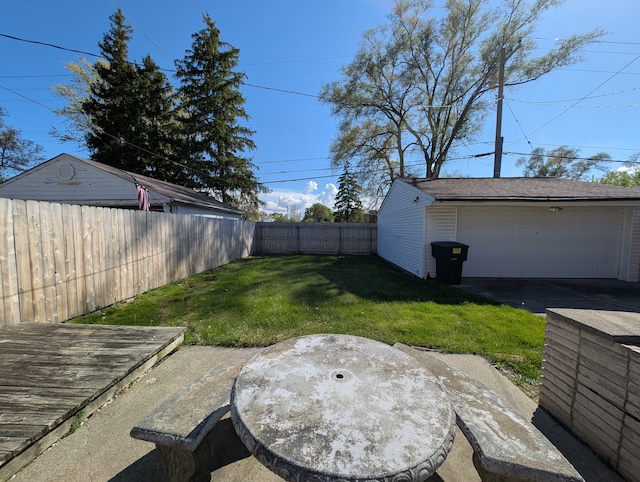 9864 E Outer Dr, Detroit, MI 48224 - view of yard with a detached garage and an outbuilding