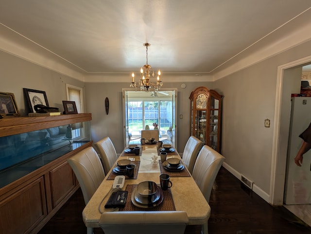 9864 E Outer Dr, Detroit, MI 48224 - dining space with a chandelier, dark wood-style flooring, and baseboards