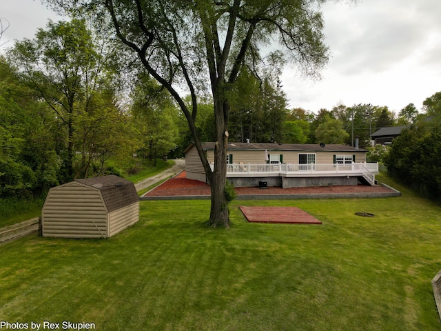 5705 Centerline Rd, Newaygo, MI 49337 - back of house with a wooden deck and a lawn