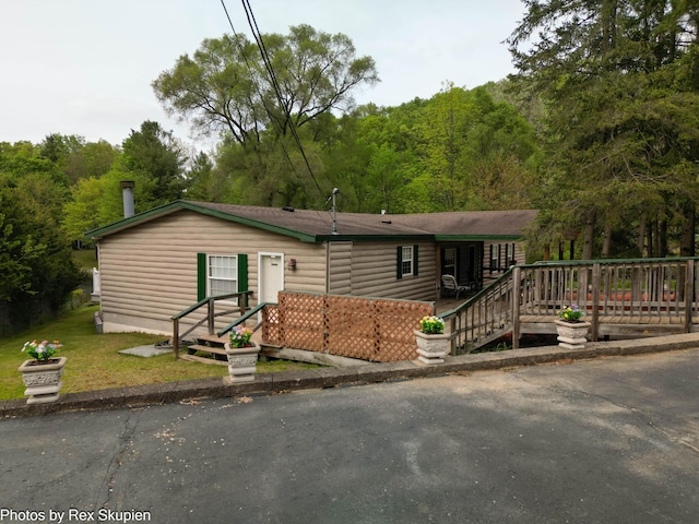 5705 Centerline Rd, Newaygo, MI 49337 - view of front of home with a wooded view