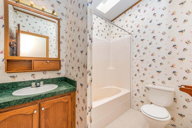 5705 Centerline Rd, Newaygo, MI 49337 - full bathroom with wallpapered walls, a skylight, vanity, toilet, and tile patterned floors