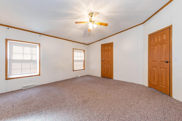 5705 Centerline Rd, Newaygo, MI 49337 - spare room featuring carpet flooring, ornamental molding, vaulted ceiling, and ceiling fan