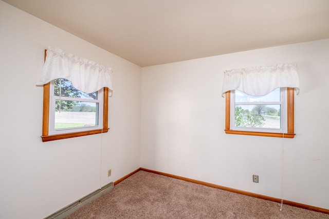 11103 N Luce Rd, Alma, MI 48801 - spare room featuring healthy amount of natural light, carpet floors, and baseboards