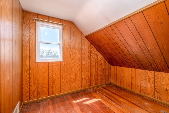 11103 N Luce Rd, Alma, MI 48801 - bonus room with hardwood / wood-style floors, lofted ceiling, and wooden walls