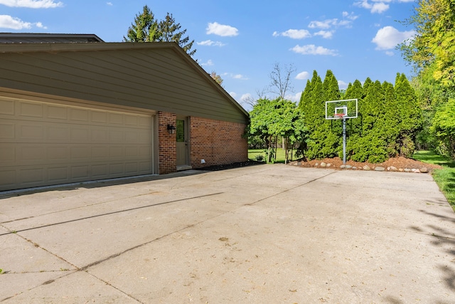 18080 Parke Ln, Grosse Ile, MI 48138 - garage featuring concrete driveway