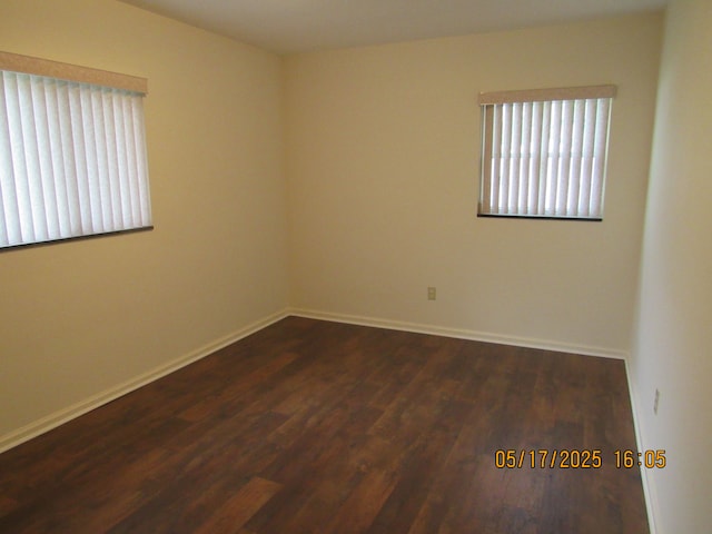 5962 Mcmillian Blvd, Dearborn Heights, MI 48127 - empty room featuring dark wood finished floors and baseboards