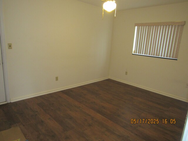 5962 Mcmillian Blvd, Dearborn Heights, MI 48127 - spare room featuring dark wood finished floors, ceiling fan, and baseboards