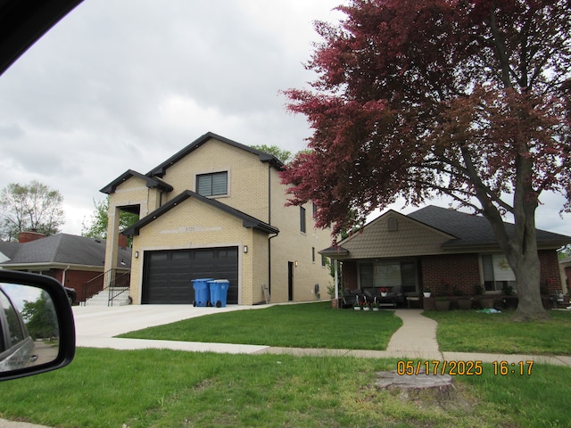 5962 Mcmillian Blvd, Dearborn Heights, MI 48127 - traditional-style home with brick siding, concrete driveway, and a front yard