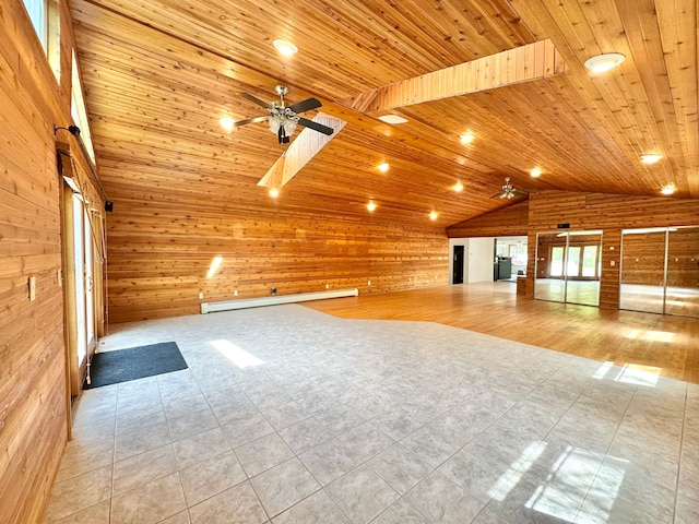 unfurnished living room featuring wood walls, lofted ceiling, wood ceiling, tile patterned flooring, and a baseboard heating unit