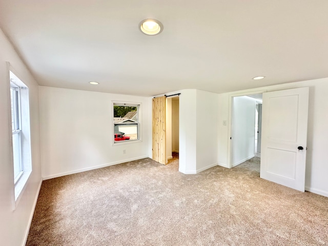 unfurnished bedroom with carpet floors, baseboards, and recessed lighting