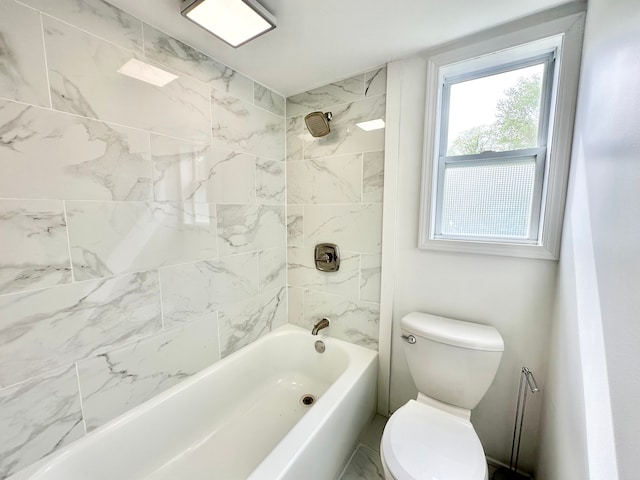 bathroom with toilet and bathtub / shower combination