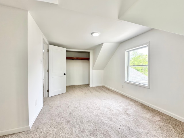 additional living space featuring carpet floors and baseboards