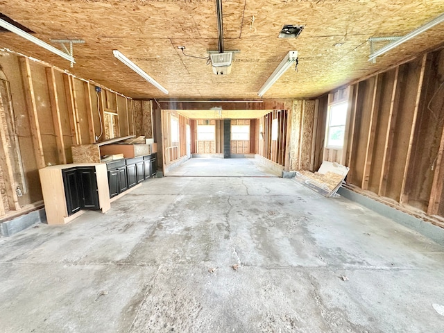 misc room with a garage