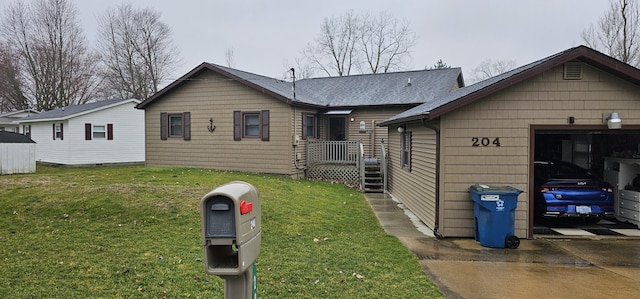 204 Crockett Dr, Quincy, MI 49082 - bungalow-style home with a front lawn, concrete driveway, and a garage