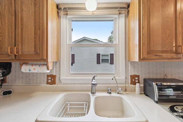 204 Crockett Dr, Quincy, MI 49082 - kitchen with brown cabinetry and light countertops