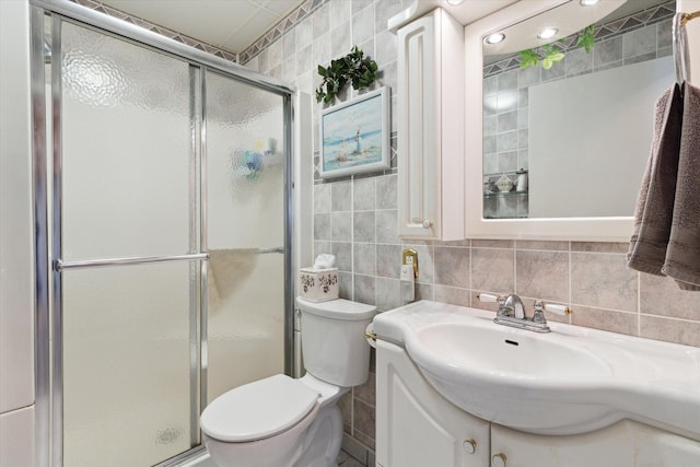 204 Crockett Dr, Quincy, MI 49082 - bathroom featuring vanity, a shower stall, tile walls, and decorative backsplash