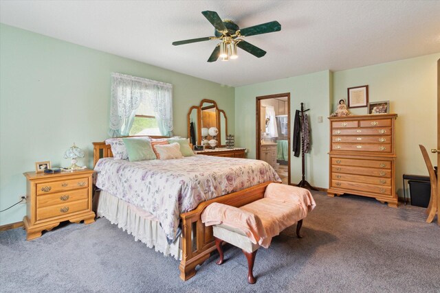 204 Crockett Dr, Quincy, MI 49082 - carpeted bedroom featuring a ceiling fan and ensuite bathroom