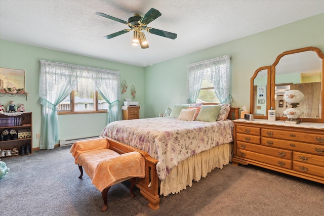 204 Crockett Dr, Quincy, MI 49082 - bedroom featuring a baseboard heating unit, multiple windows, carpet flooring, ceiling fan, and a textured ceiling