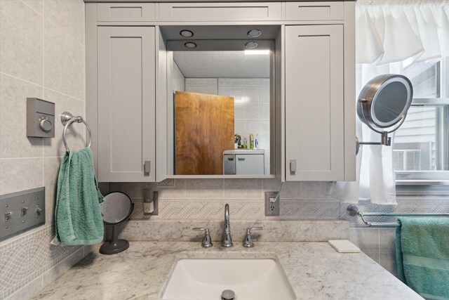 204 Crockett Dr, Quincy, MI 49082 - bathroom with tile walls and tasteful backsplash