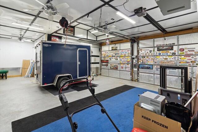 204 Crockett Dr, Quincy, MI 49082 - workout room with a garage and ceiling fan