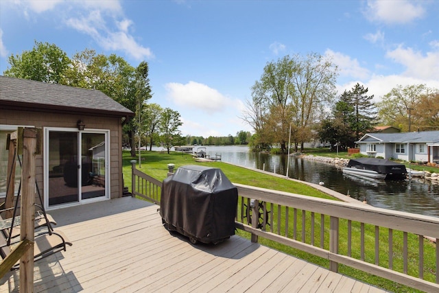 204 Crockett Dr, Quincy, MI 49082 - wooden terrace with area for grilling, a water view, and a lawn