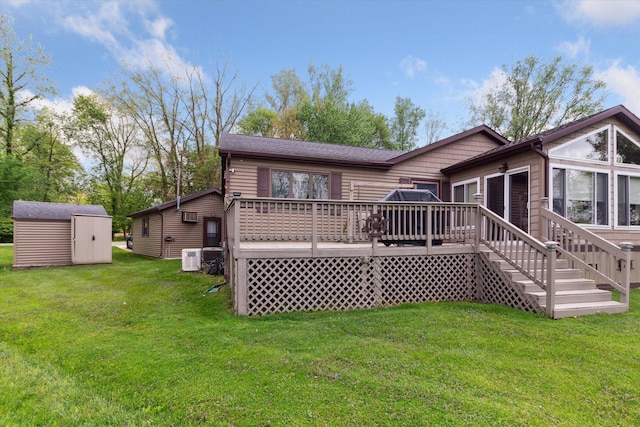 204 Crockett Dr, Quincy, MI 49082 - rear view of house featuring a deck, a shed, and a lawn