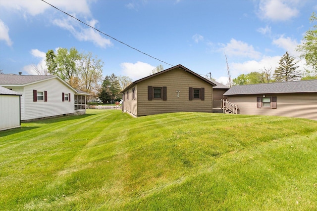 204 Crockett Dr, Quincy, MI 49082 - rear view of house with a yard