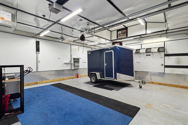 204 Crockett Dr, Quincy, MI 49082 - garage featuring a garage door opener